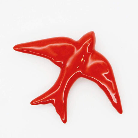 Hirondelle traditionnelle en céramique rouge